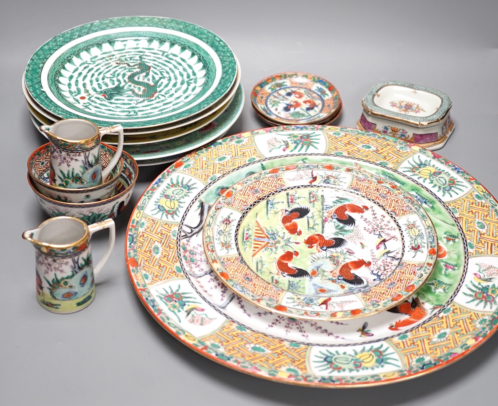 A group of 20th century Chinese enamelled porcelain plates dishes bowls and two jugs, Charger 38.5 cm